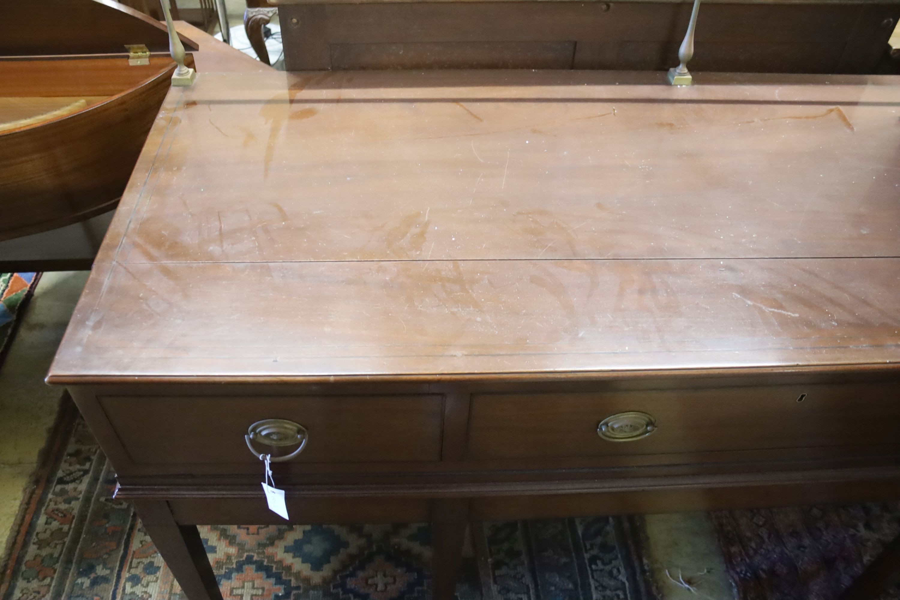 A George III style mahogany three drawer serving table, width 168cm, depth 64cm, height 112cm